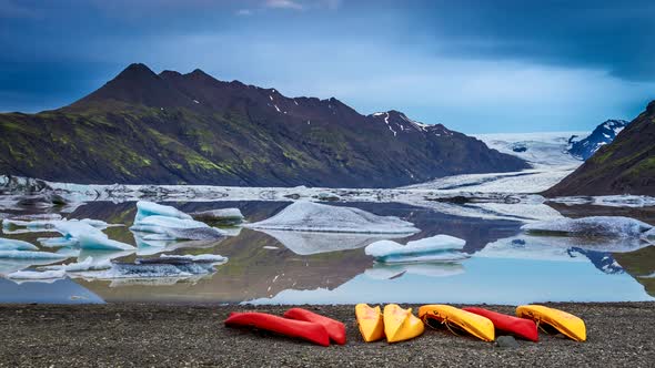 Kayaking by glacier on sunrise in Iceland alt