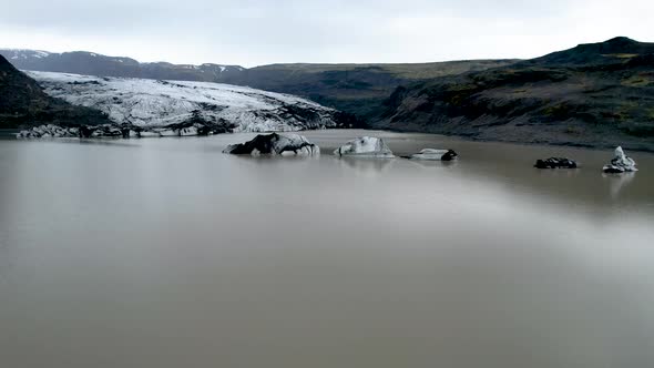 Iceland Glacier Drone with Icebergs flying over Glacial Lake