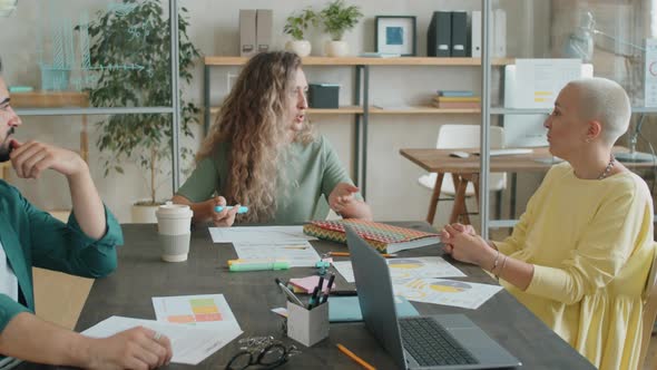 Diverse Colleagues Having Discussion at Business Meeting