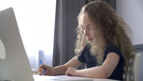 Smiling Young Girl Drawing with Felt-tip Pens