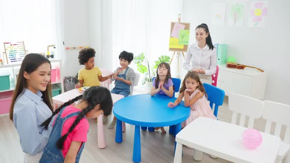 Asian beautiful young woman teacher teaching a lesson to kid in classroom at preschool kindergarten