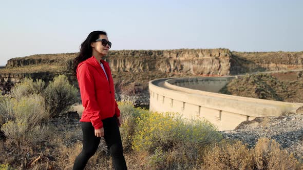 Asian woman hiking near the Salmon Falls Dam in Southern Idaho