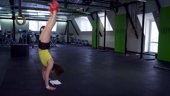 Fitness Woman Walks on Her Hands