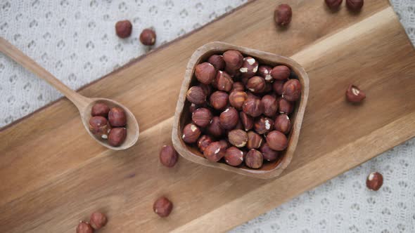 Closeup Of Healthy Hazelnuts In Wooden Bowl.