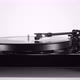 Turntable with Spinning Vinyl Record on White Table - VideoHive Item for Sale
