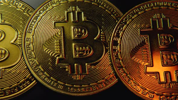 Bitcoin cryptocurrency. The camera flies over the Bitcoin coins from left to right