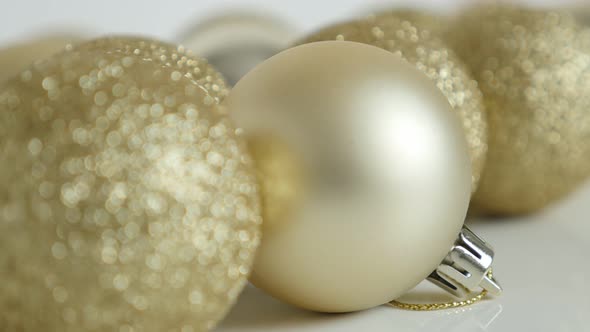 Christmas baubles on white shallow DOF 4K tilting footage