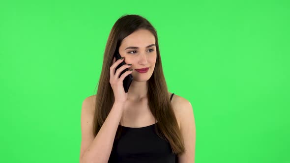Portrait of Girl Talking for Mobile Phone. Green Screen