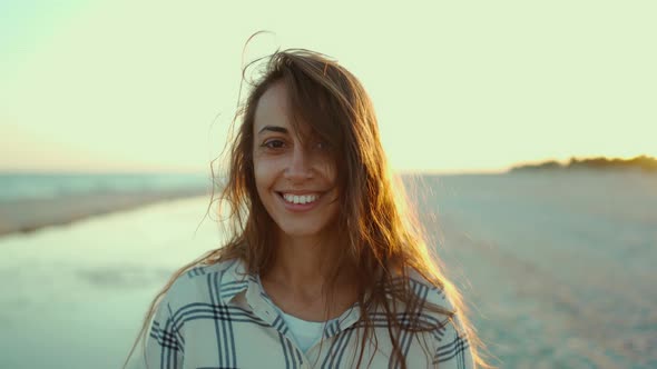 Outdoors Portrait of Happy Attractive Mixed Race Woman Enjoying Walk on Wild Sea Sand Beach at