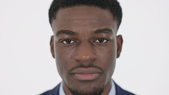 Serious Face of African Businessman on White Background