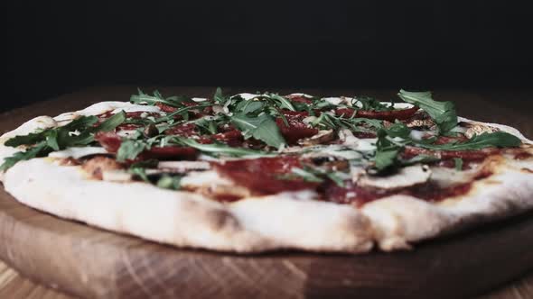 Appetizing Pizza on a Wooden Board in a Restaurant