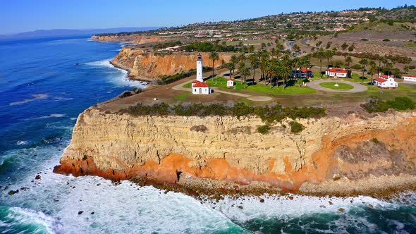 Aerial view panning up at the light house on the cliffs of Rancho Palos Verdes in Southern Californi