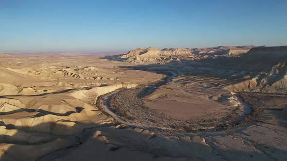 Aerial footage at Sde Boker, in Neguev desert of Israel. Dry river in the desert landscape.