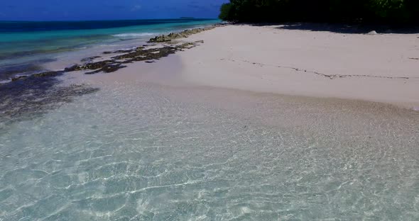 Natural aerial travel shot of a summer white paradise sand beach and blue sea background in high res