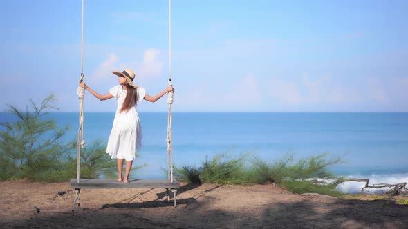 Asian woman enjoy around beautiful beach sea ocean