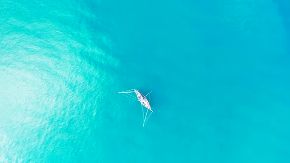 Aerial drone view panorama of beautiful island beach voyage by turquoise sea and white sandy backgro
