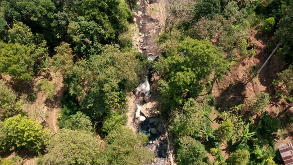 Drone Over Rapids Running Through Forest