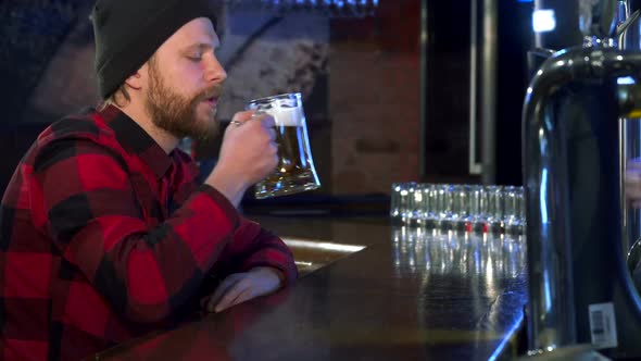 Guy Takes Beer at the Pub