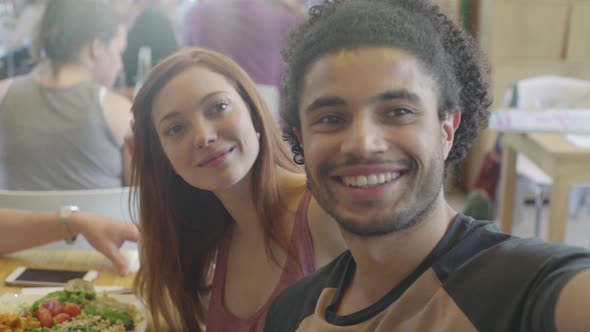 Friends in restaurant posing for selfie