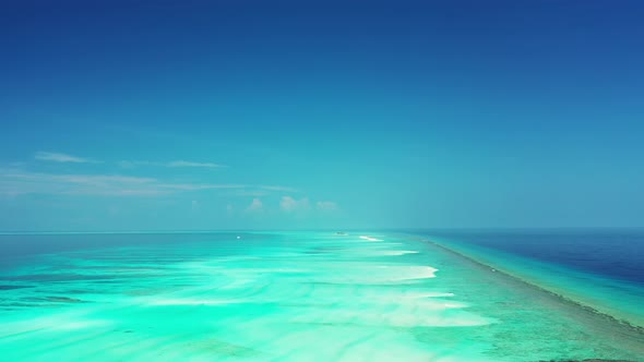 Natural flying clean view of a summer white paradise sand beach and aqua blue ocean background in be