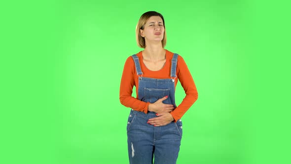 Cute Female Feels Very Bad, Her Stomach Hurts . Green Screen