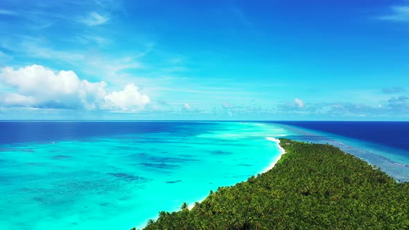 Wide angle aerial island view of a sandy white paradise beach and turquoise sea background in colour