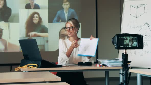 A Teacher Is Talking To Adult Students During an Online Lesson