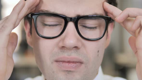 Man in Glasses with Headache and Stress