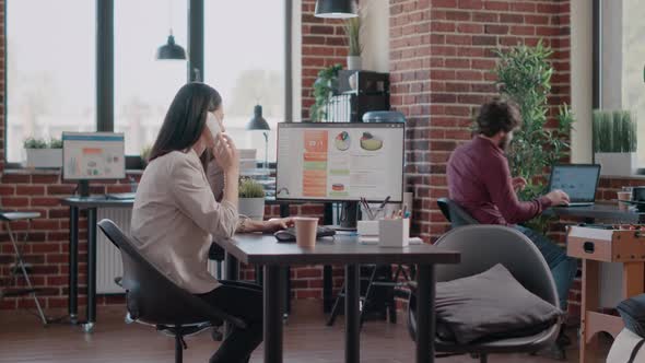 Child Interfering with Working Mother Talking on Landline Phone Call