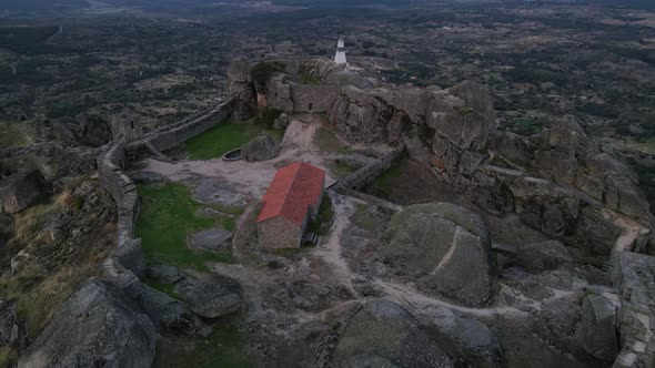 Drone view of the Monsanto Castle area with specific focus on the horizon where the land and the sky