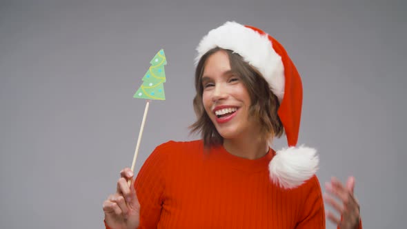 Woman in Santa Helper Hat Having Fun on Christmas