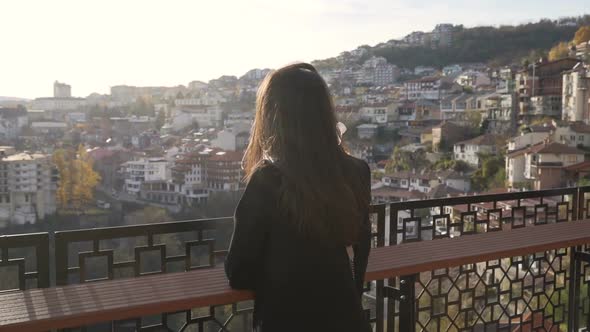 Brunette Girl Enjoying Panoramic View Over Veliko Tarnovo City at Susnet