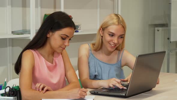 Two Beautiful Female Students Studying Using Laptop Together 1080p