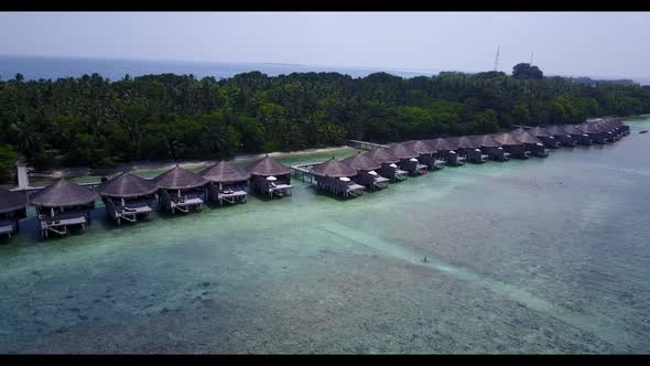 Aerial above panorama of tranquil shore beach trip by blue sea and white sand background of a dayout