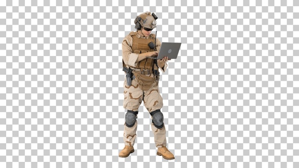 Soldier standing and using laptop, Alpha Channel