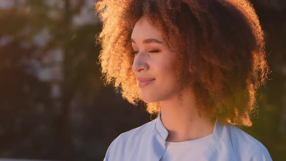 Female Outdoors Portrait Beautiful Young Ethnic African American Girl Looks to Side Afro Smiling