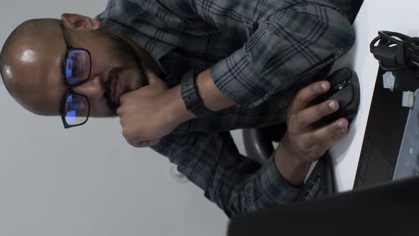 Close up shot of an Indian entrepreneur reviewing a business document on a computer, making small co