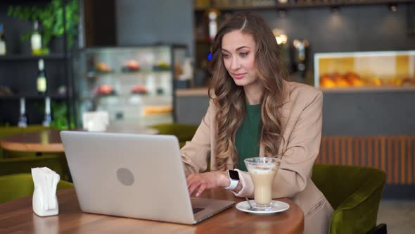 Business Woman Restaurant Owner Use Laptop Dressed Elegant Pantsuit Sitting Table In Restaurant With