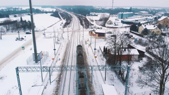 Train Moving Over the Snow Covered Railroad