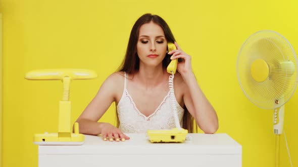 Young Woman Has Problems With Landline Phone Connection