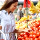 Picture of Woman at Marketplace Buying Vegetables - VideoHive Item for Sale