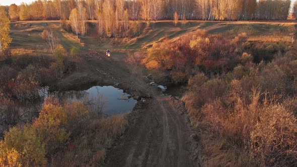 Motorcyclist passes the dam