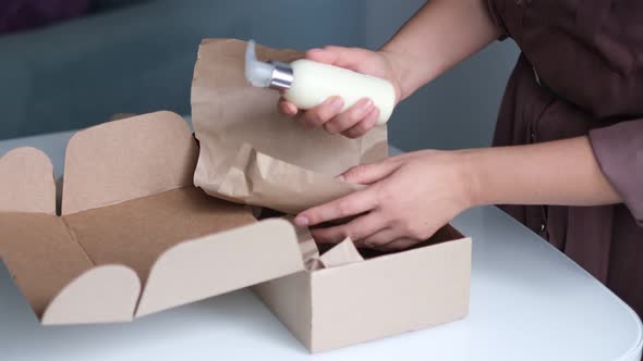 Woman at Home Opening Carton Box Just Delivered Parcel on Address