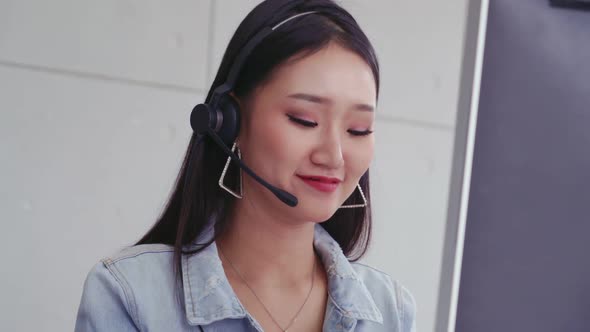 Customer Support Agent or Call Center with Headset Talking to Customer on Phone