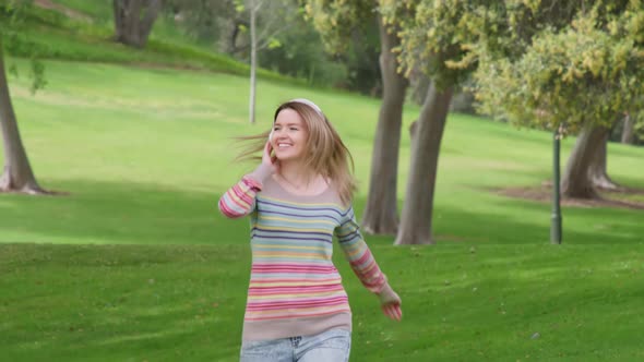 Happy Smiling Young Blonde Woman Feeling Elevated Flying and Having Fun  Shot