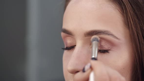 Cropped View of Girl's Face in Process of Doing Makeup