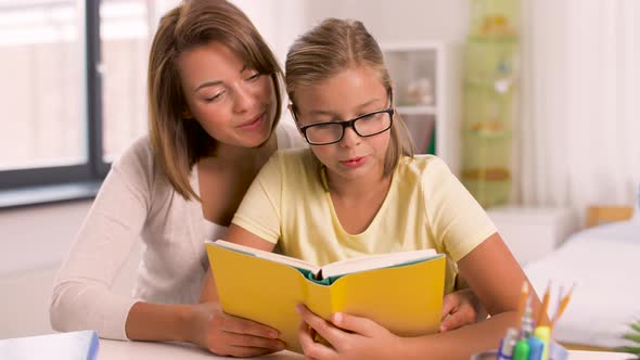 Mother and Daughter Doing Homework Together 9