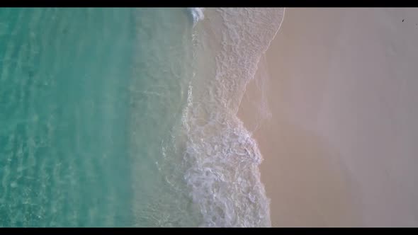 Aerial drone sky of perfect island beach adventure by blue lagoon and white sandy background of a da