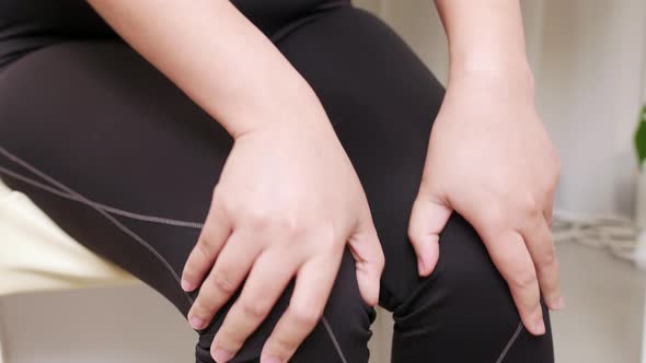 Woman having knee pain the concept of preventing leg fatigue and self-massage