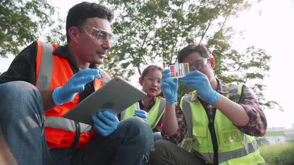 Biological engineer team checks pH value of factory wastewater by the Colorimetric method.